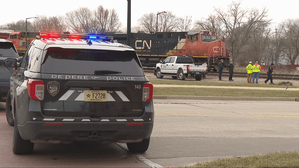 Woman in her 80s hospitalized after being hit by train in De Pere