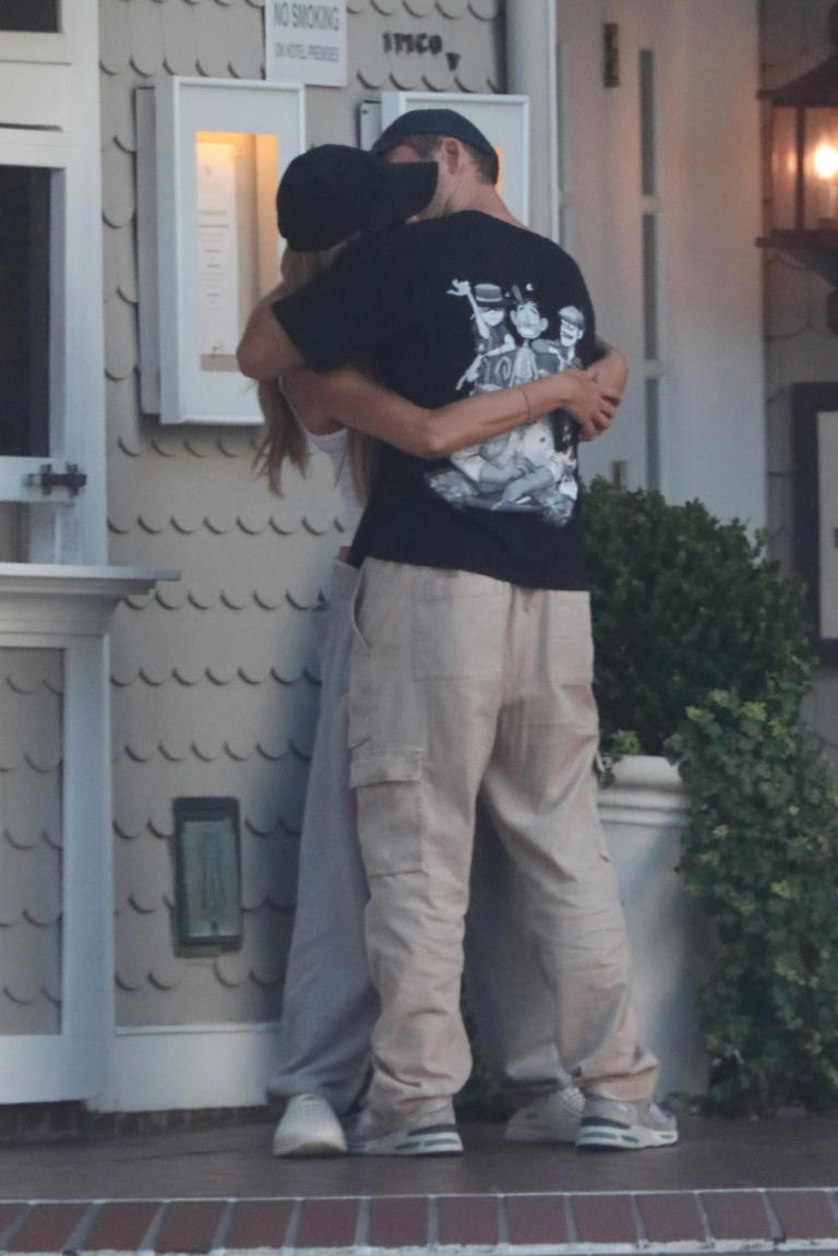 Brooks Nader and Taron Egerton passionately kiss during LA date night