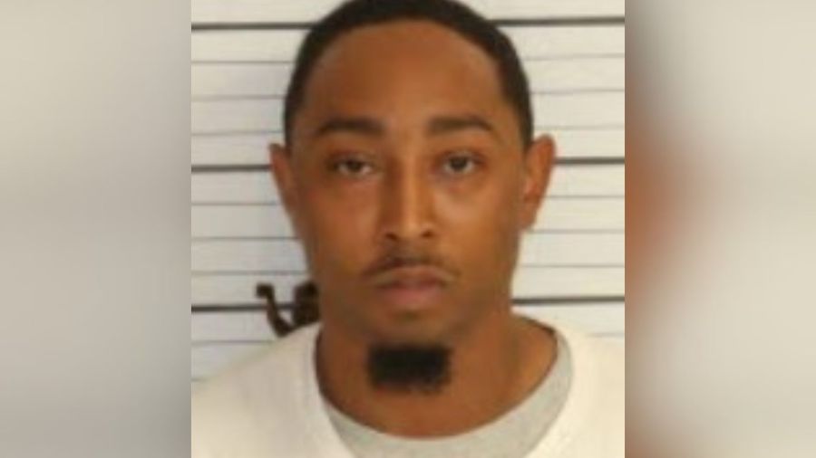 Man charged after victim found shot to death in front yard of home