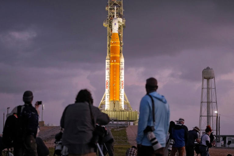 Photographers set up remote cameras near NASA’s Artemis II moon rocket on Launch Pad 39-B just before sunrise at the Kennedy Space Center Tuesday, March 31, 2026, in Cape Canaveral, Fla. (AP Photo/Chris O’Meara)