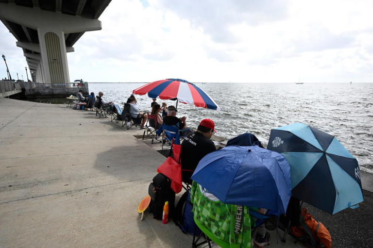 Space enthusiasts camp out underneath the A. Max Brewer Bridge while waiting to view the NASA Artemis II launch, Wednesday, April 1, 2026, in Titusville, Fla. (AP Photo/Phelan M. Ebenhack)