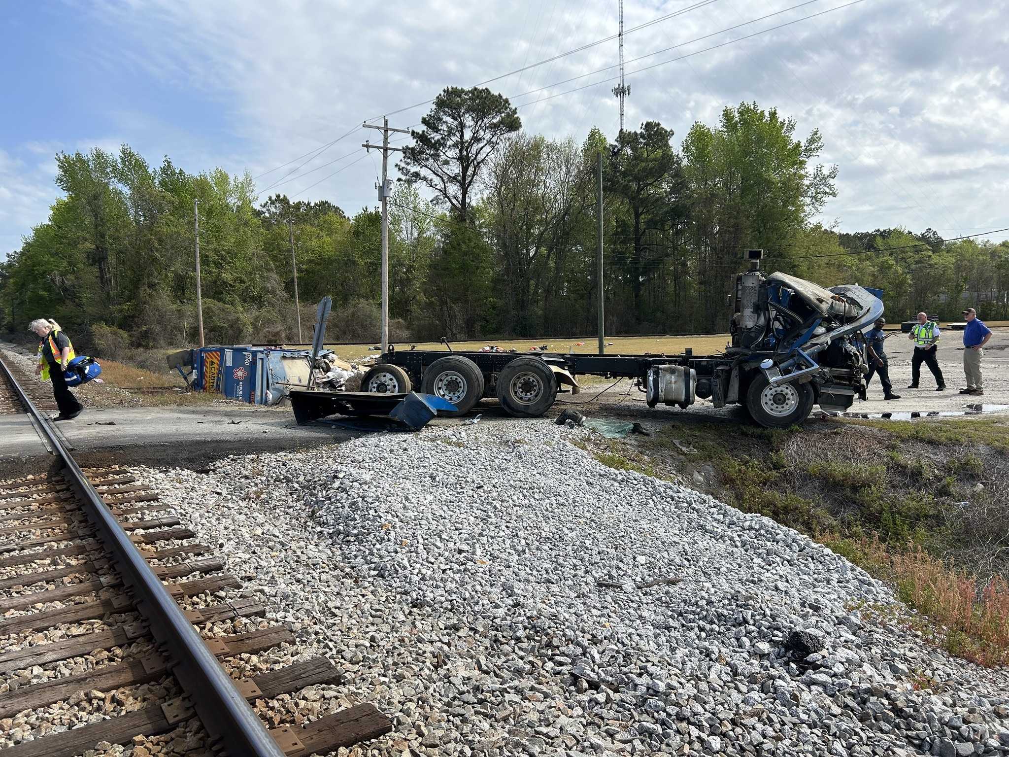 Train carrying more than 100 passengers slams into garbage truck ...