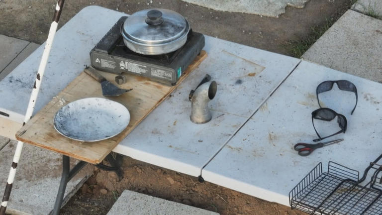 A makeshift cooking station in front of the shipping container where Freeman was found.