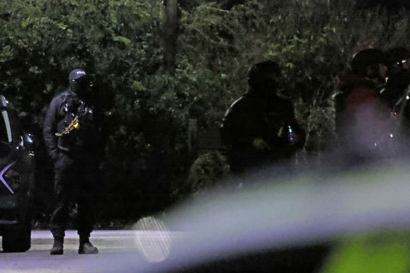 Moment armed police surround house in Newton-le-Willows as officers ...