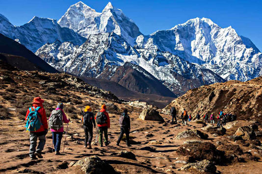 Stock photo of trekkers walking back to Namche Bazaar from Everest Base Camp trekking in Nepal. Credit: Getty