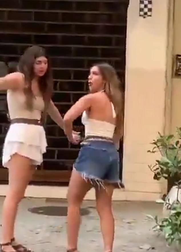 An Argentine tourist could face up to five years in prison in Brazil after she was filmed making a racist gesture toward bar staff in a video that quickly spread online