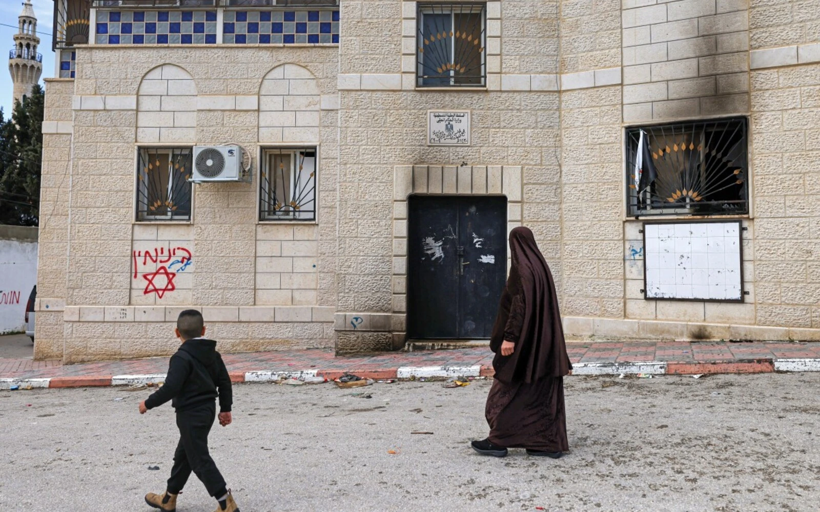 Israeli settlers burn buildings in attacks on West Bank villages