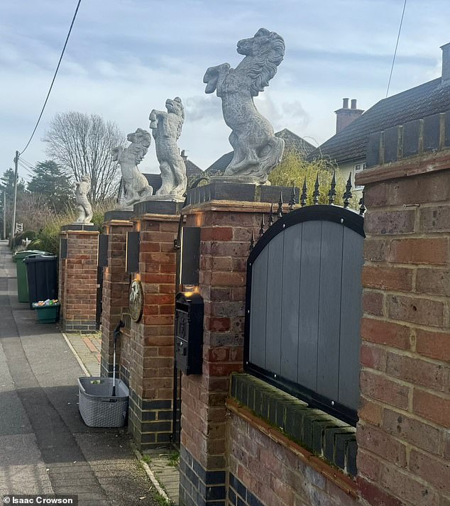 Travellers who built wall topped with horse statues accuse neighbours of 'not liking Gypsies'