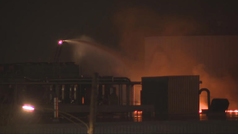 Flames, smoke seen from roof of Fuyao building