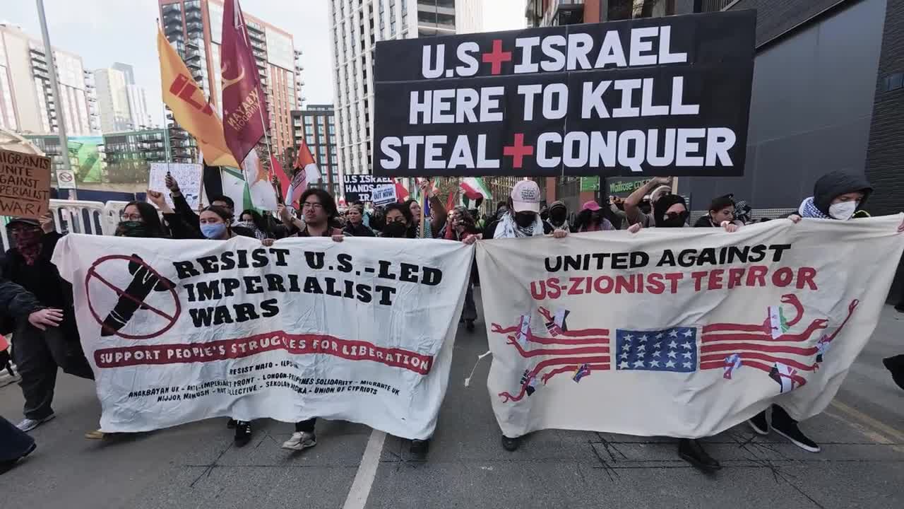 Protesters march from the US Embassy in London against US and Israeli ...