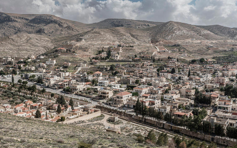 The village sits at the foothills of the arid Qalamoun mountains, over which you can trek just a few kilometres into Syria - Simon Townsley