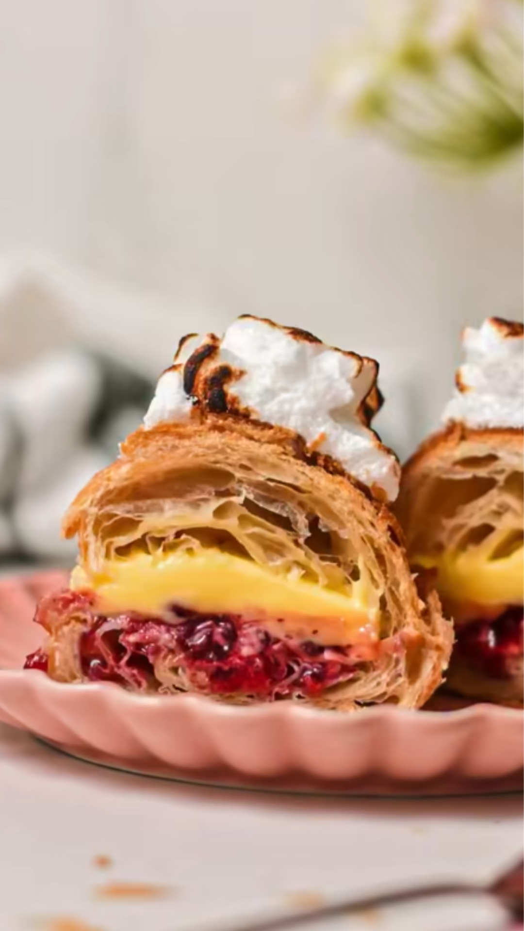 Flaky pastry layers filled with cream and berries that melt in every bite