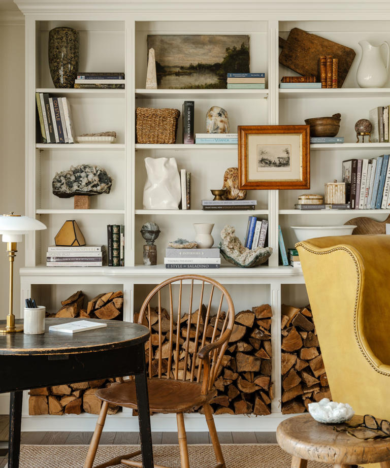 Why interior designers love hanging art in front of bookshelves