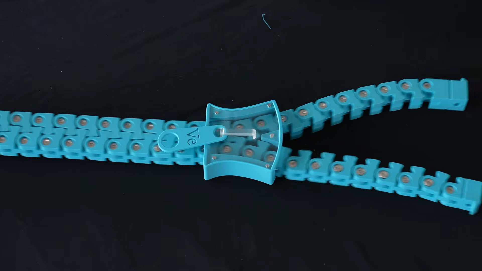 Watch what happens inside a zipper when you pull it