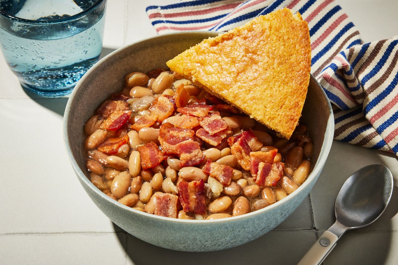 Southern Living Pinto Beans in a bowl with a piece of cornbread to serve