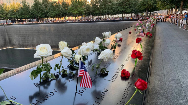 Colorful flowers are left by mourners at the 9/11 Memorial, offering gifts to remember those killed in the September 11 terrorist attacks on New York City. Getty Images