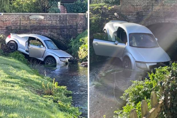 Car crashes into river near pub