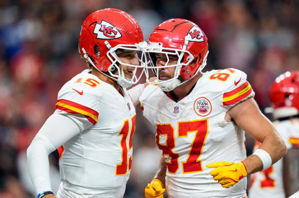Patrick Mahomes and Travis Kelce celebrate on the field