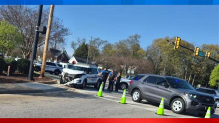Greenville officer, driver hospitalized after crash, police say