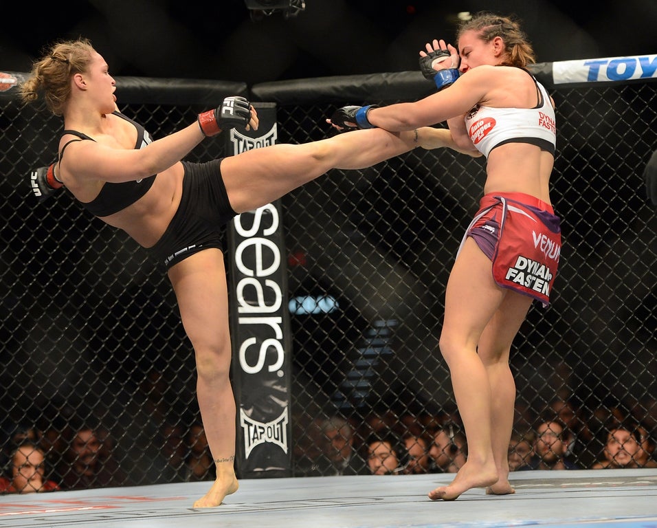 UFC legend, WWE star, SI swim model: Ronda Rousey’s fiercest moments