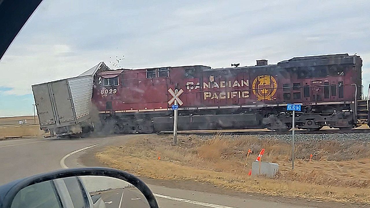 Train smashes through semi-trailer stopped on level crossing in Canada