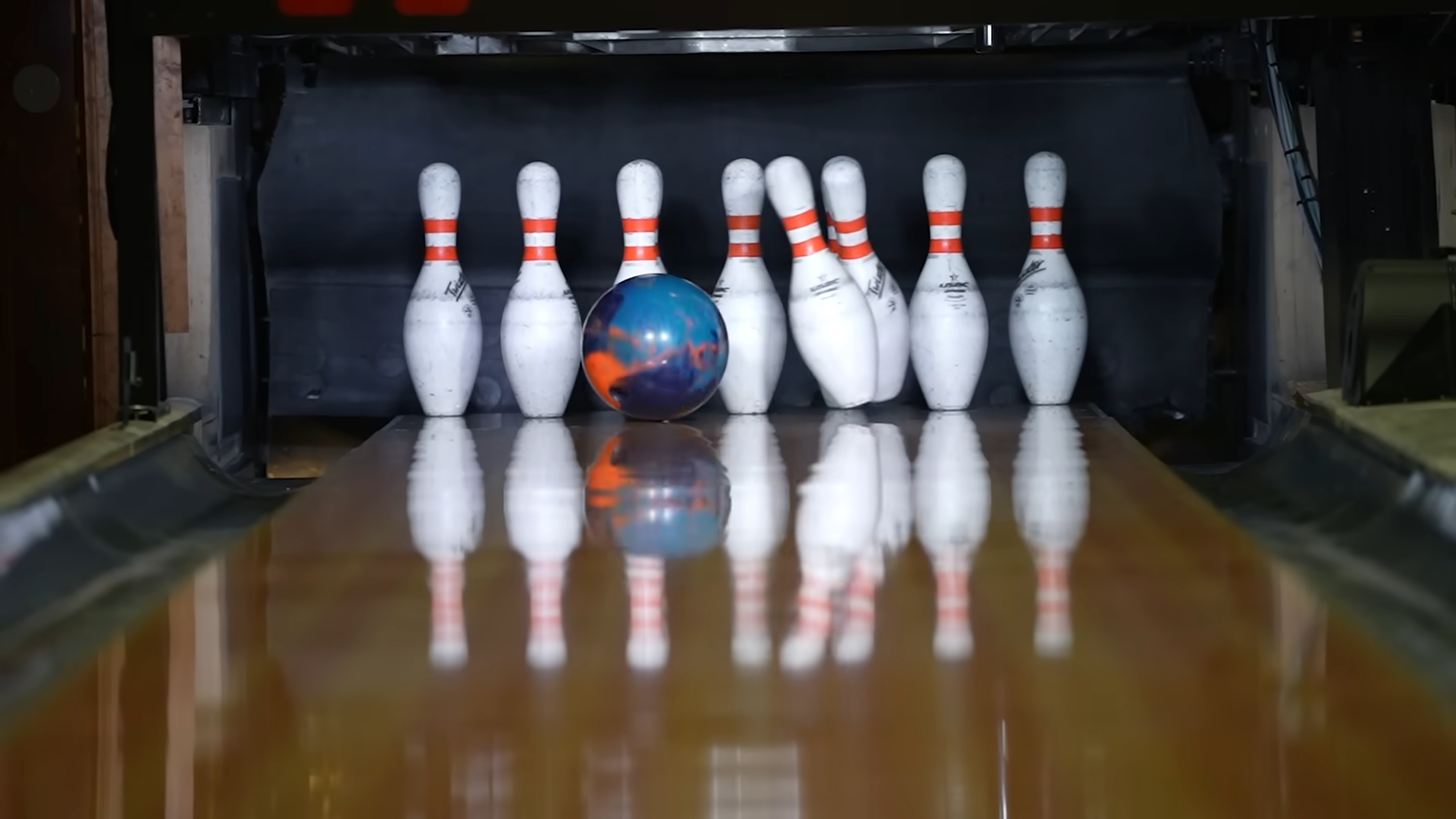 Watch what happens when a bowling ball hits the oil pattern