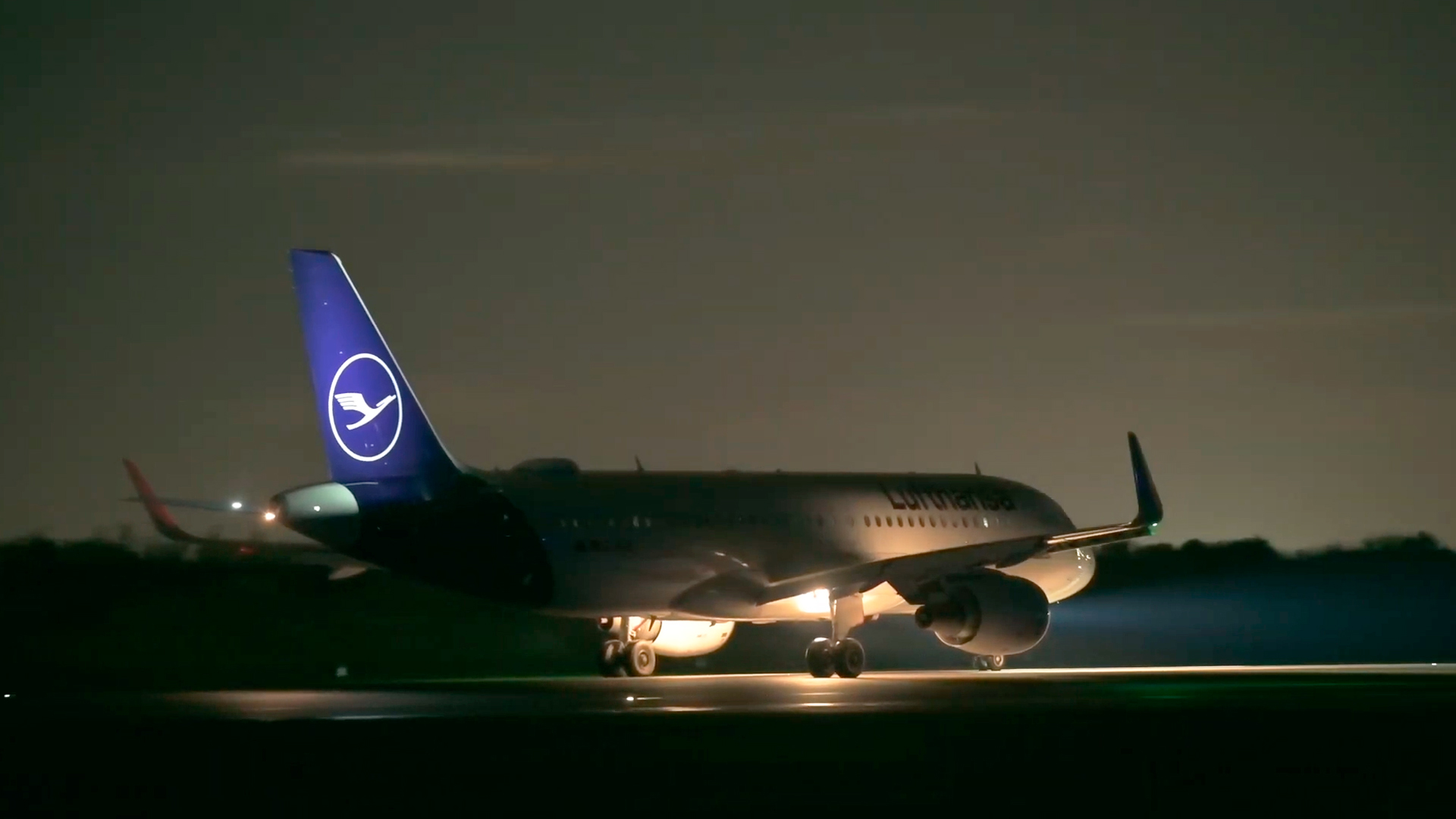 Planes turn around on runway at night