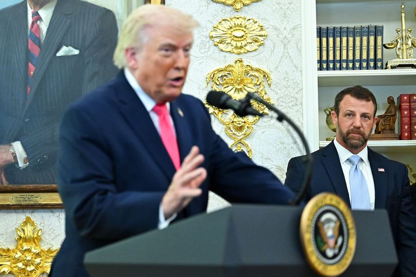 Trump (L) speaks next to and Markwayne Mullin, the new secretary of the US Department of Homeland Security