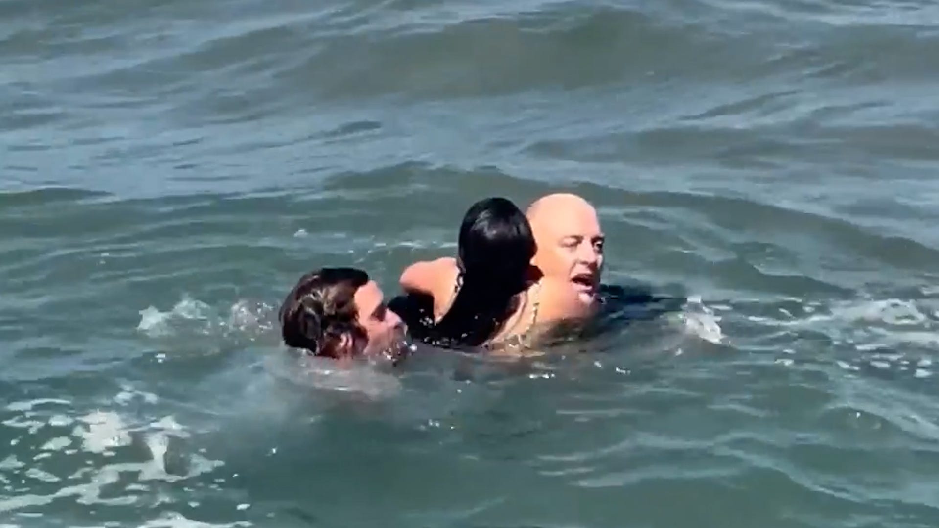 California surf coach bravely rescues two swimmers caught in rip current<br><br>