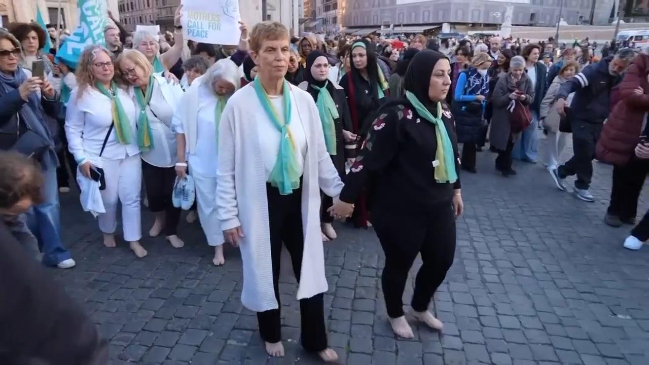 Palestinian and Israeli mothers lead dozens in barefoot march for peace ...