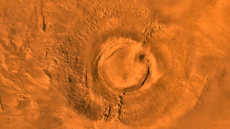 A rare active volcano on Mars may be causing the whole planet to spin ...