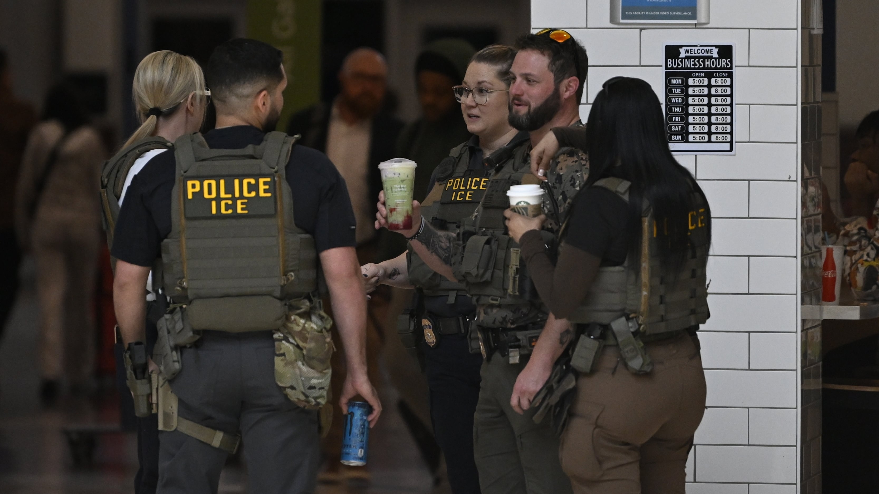 ICE agents have been seen in bulletproof vests and sipping coffee in airports across the country. / Anadolu / Anadolu via Getty Images