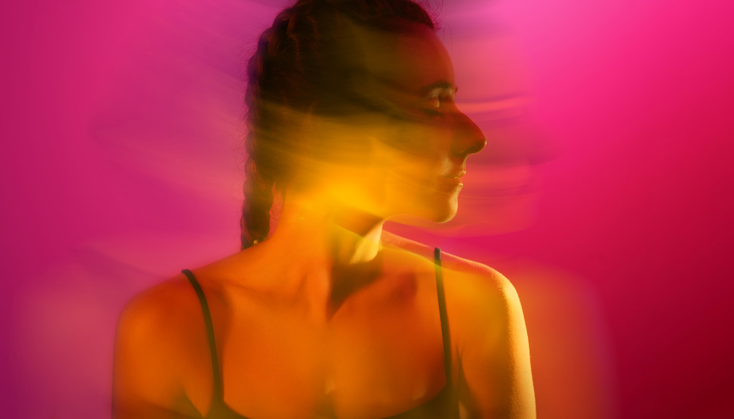 Abstract portrait of a woman with light trails. Brain fog and digital metaphor