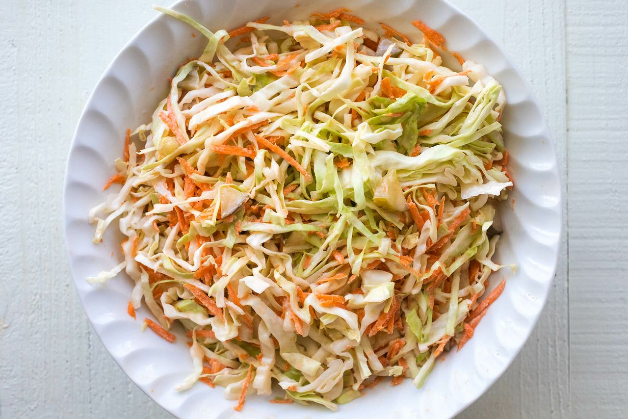 cabbage slaw in a white bowl