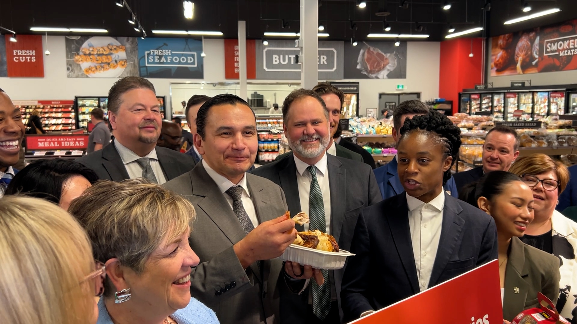 Manitoba premier eats chicken, promotes budget
