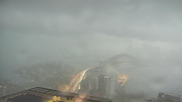 Transport woes as storm dumps rain and hail on Sydney