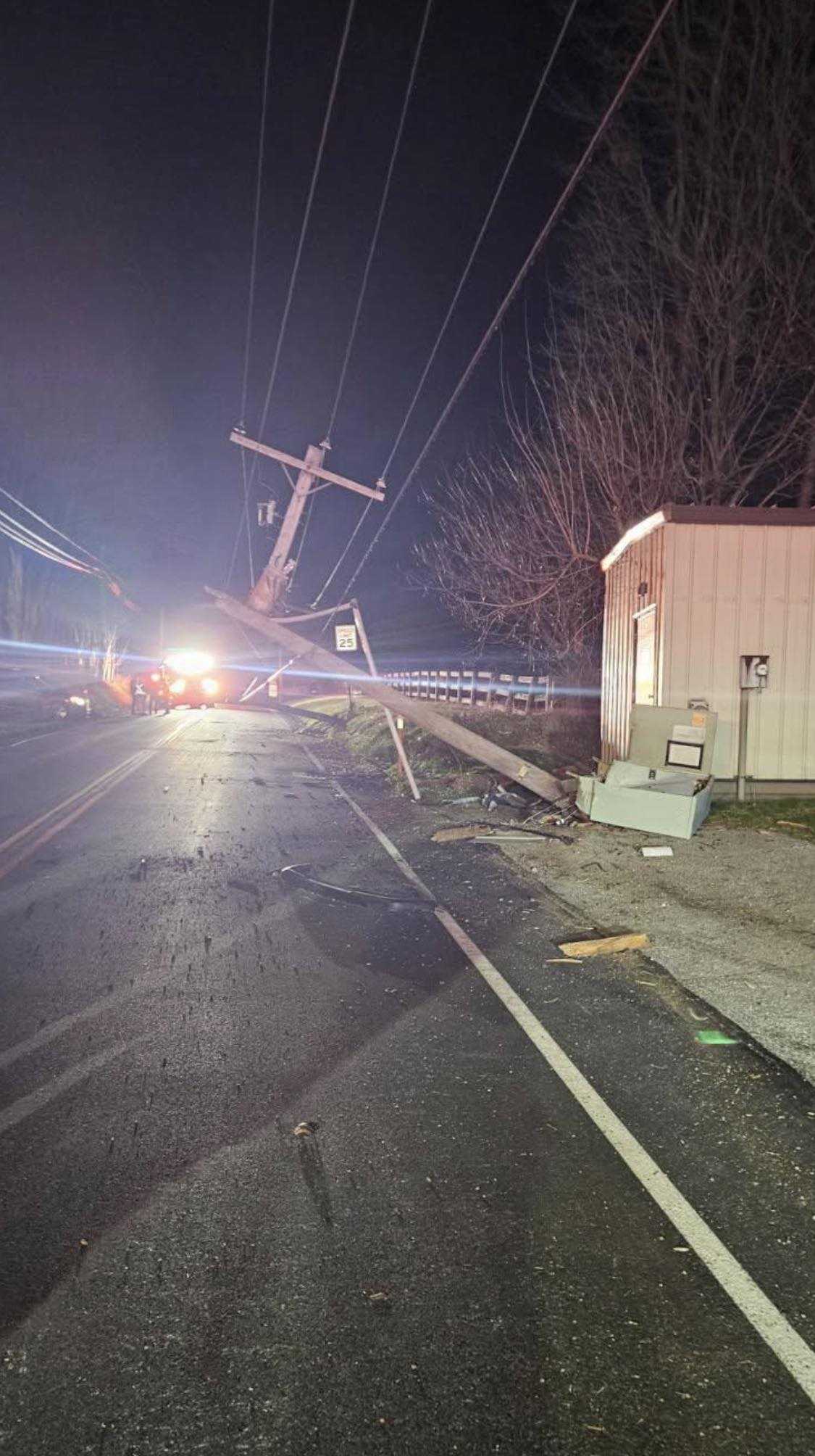 Driver cited after crashing into barn, snapping two utility poles ...
