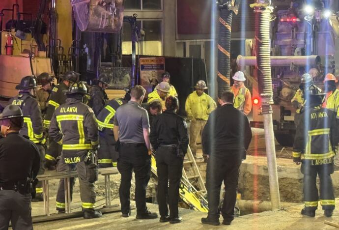 Construction worker rescued after falling 15 feet into manhole