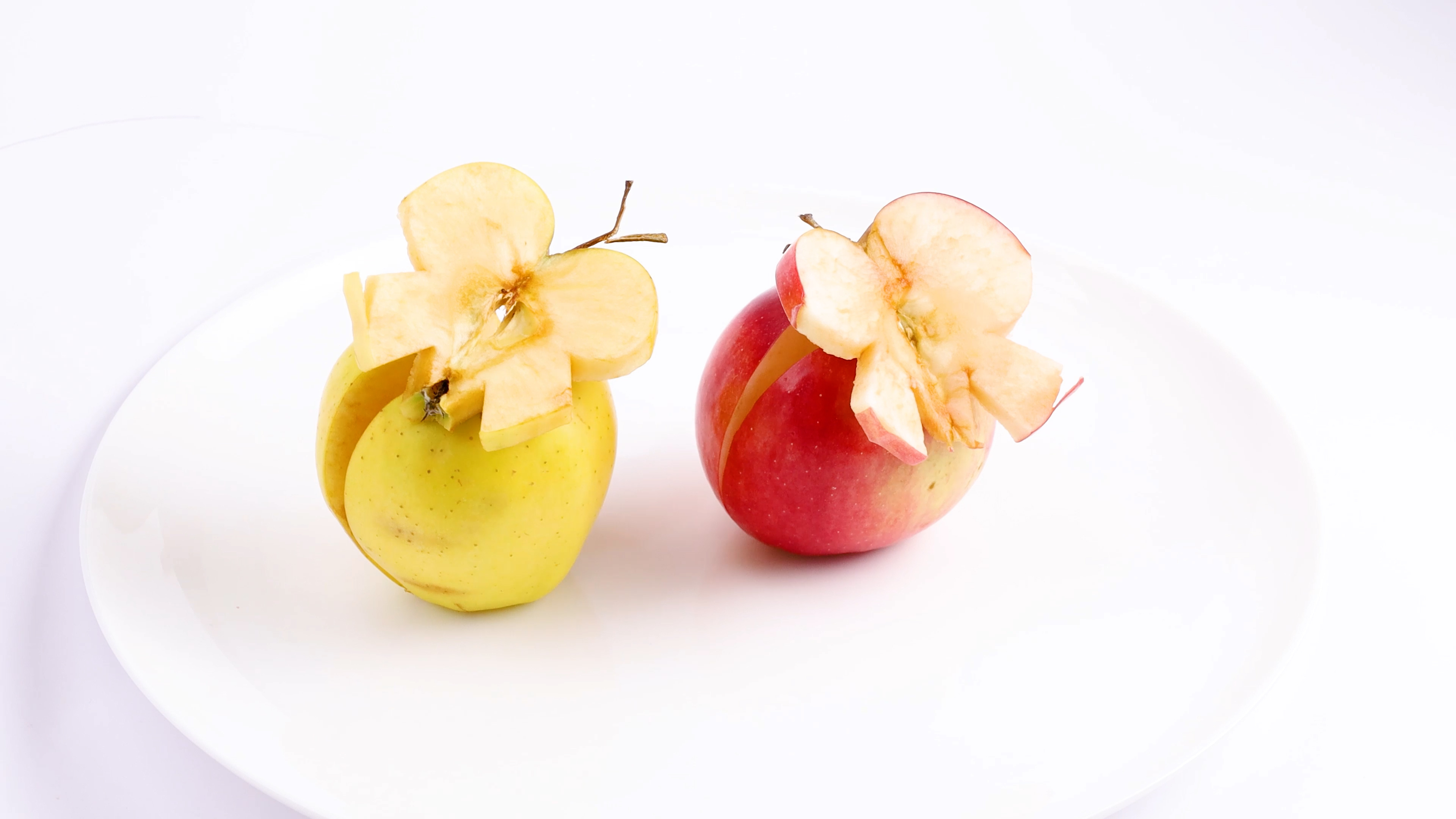 Cutting apples into butterfly shapes