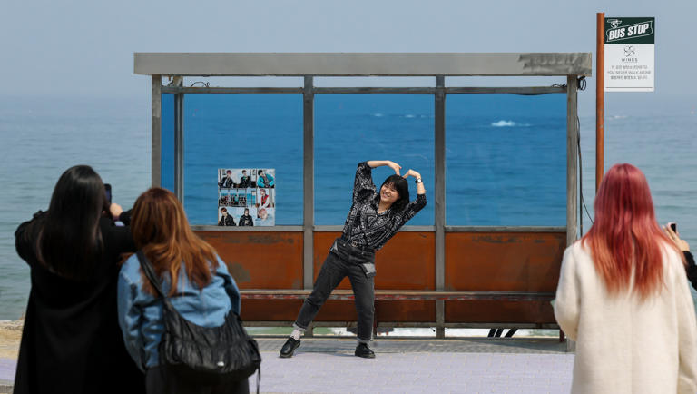 Foreign fans flock to BTS sacred sites post-comeback