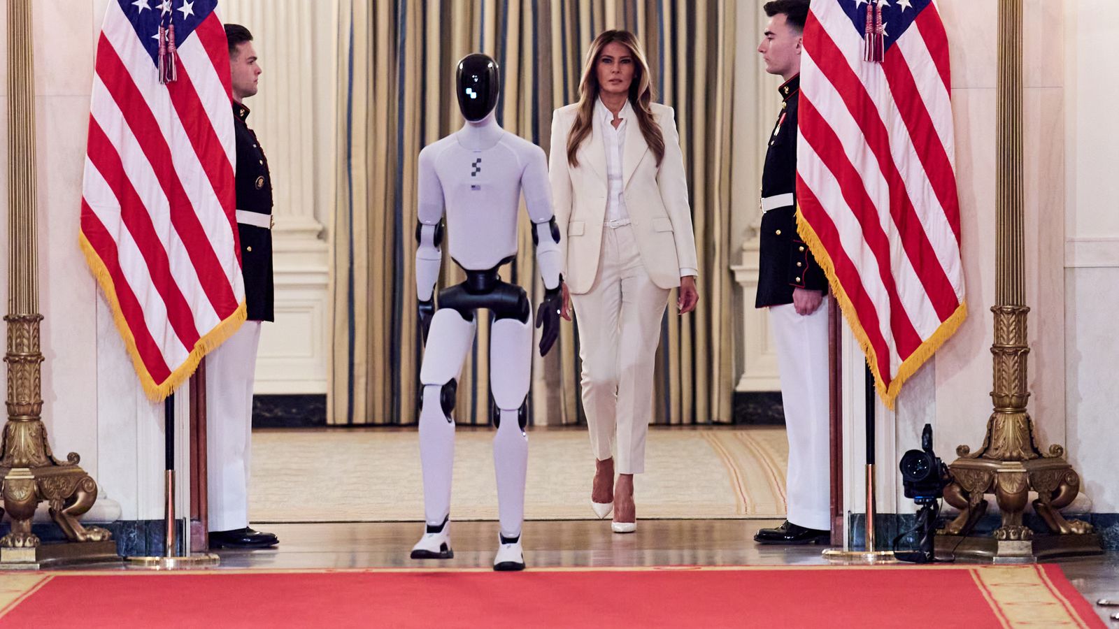 Melania Trump arrives with robot at tech event