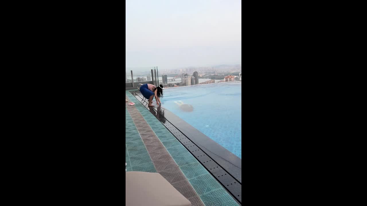 Person falls into swimming pool while filming a swimmer underwater in ...