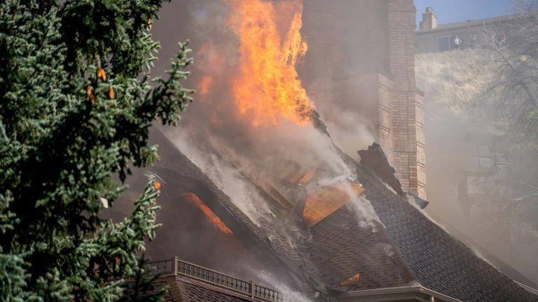 Photos: Two pets rescued from large house fire in Sandy neighborhood
