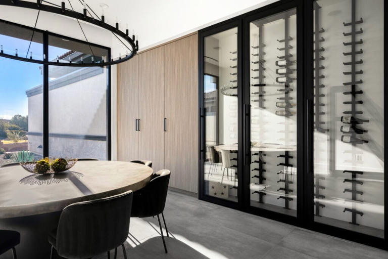 Forest-inspired surfaces add tactile depth to minimalist custom home