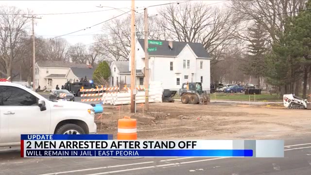 2 men arrested after stand off will remain in jail
