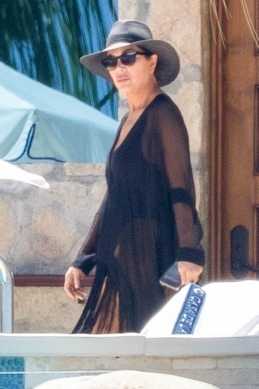 <p><a href="https://www.wonderwall.com/celebrity/profiles/overview/kris-jenner-1409.article">Kris Jenner</a> wore a black coverup and matching hat over her black swimsuit while vacationing in Cabo San Lucas, Mexico, on April 15.</p>