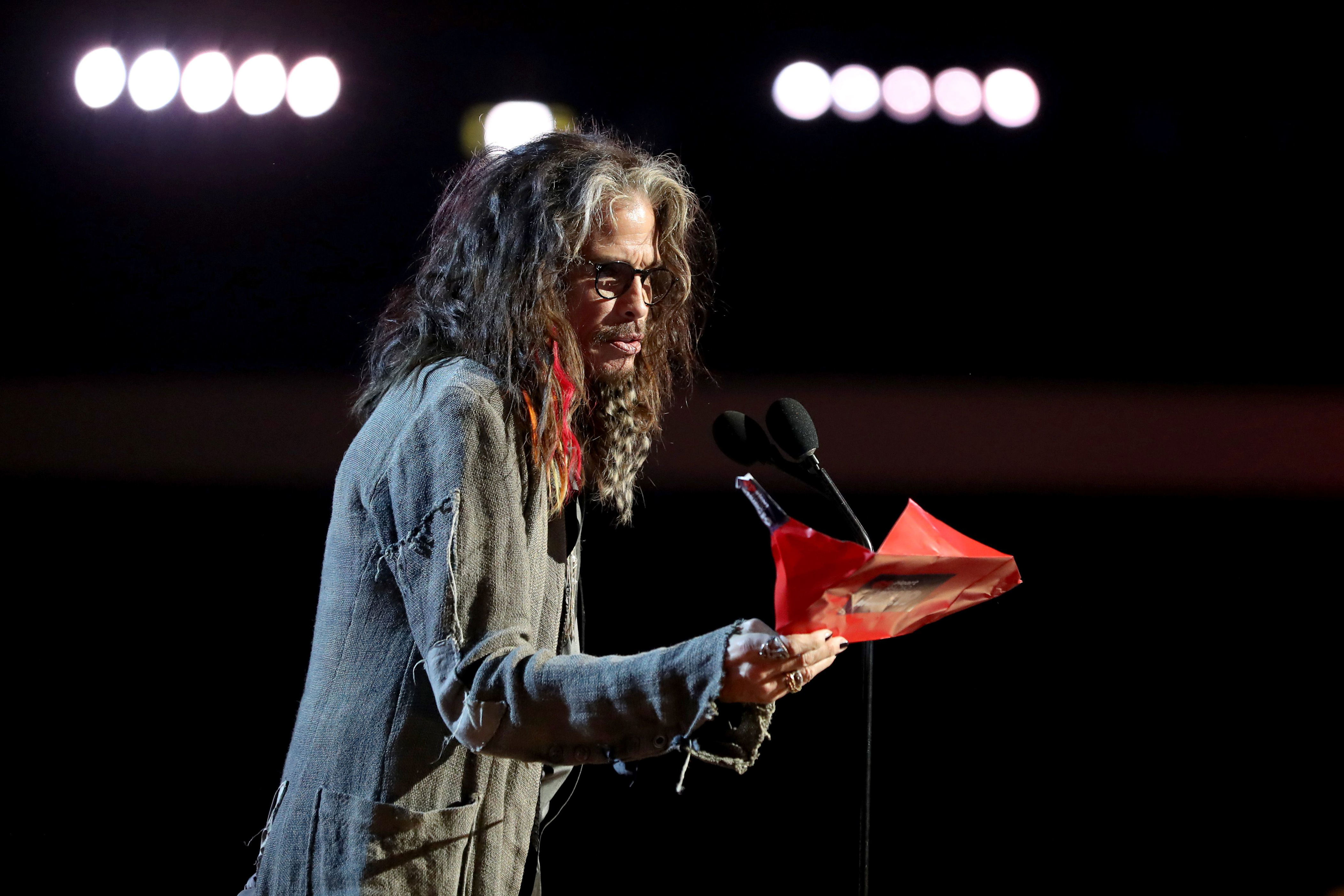 LOS ANGELES, CALIFORNIA - MARCH 14:  Steven Tyler presents on stage at the 2019 iHeartRadio Music Awards which broadcasted live on FOX at the Microsoft Theater on March 14, 2019 in Los Angeles, California. (Photo by Rich Fury/Getty Images for iHeartMedia)