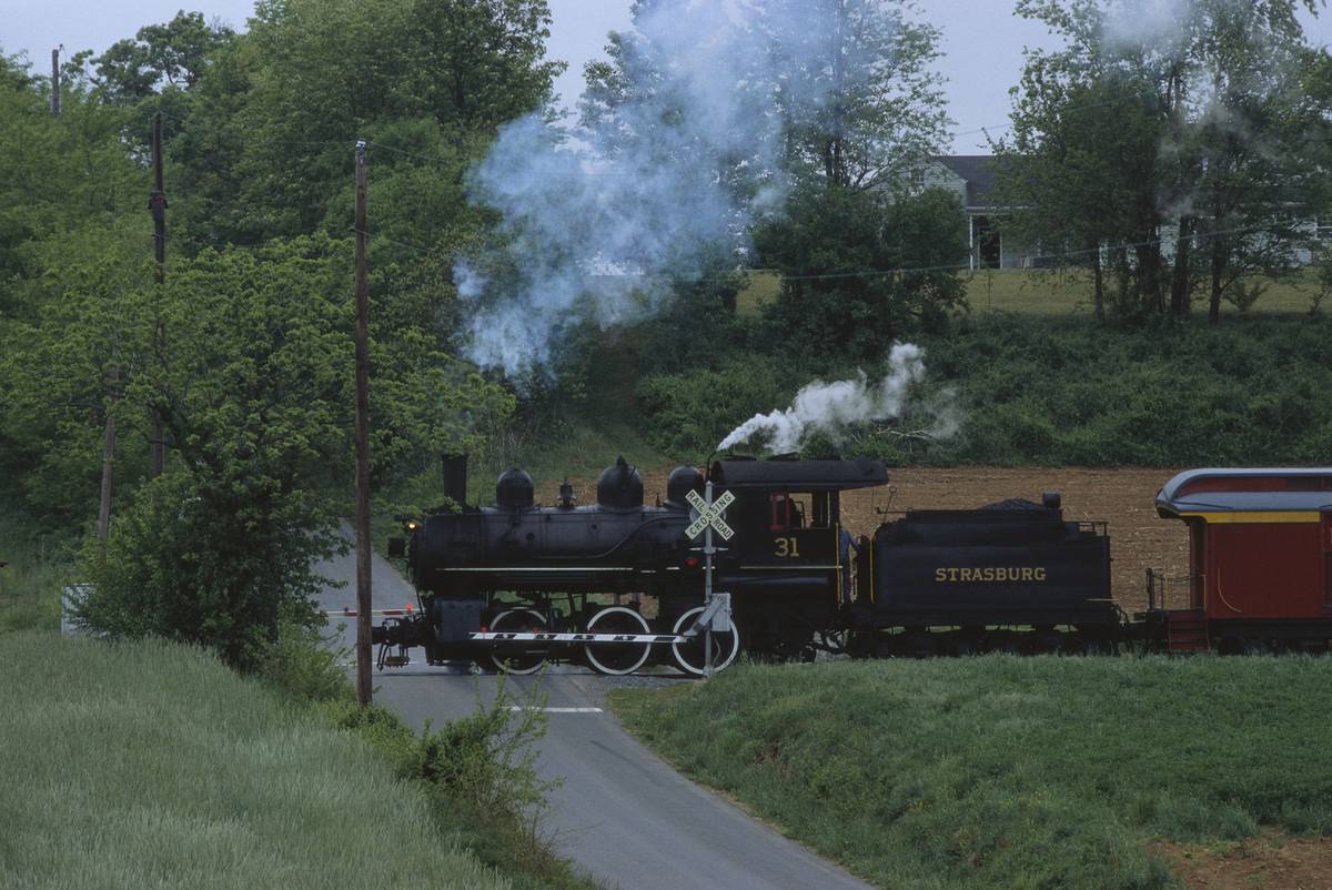 <p>The <i>Strasburg Railroad</i> has operated since 1832, making it one of America's oldest railroads. The short, 45-minute train ride takes visitors through the Amish countryside of Pennsylvania. The trains mirror authentic steam locomotives, with pumps cars and conductors dressed as 19th-century employees.</p> <p>The <i>Strasburg</i> slices through Pennsylvania's industrial heart, filled with rolling hills and farms that once fed the entire state. The trip offers "train robbery" and "murder mystery" rides, complete with full performances that transport passengers back to 1934. At its cheapest, <i>Strasburg Railroad</i> only costs $15!</p>