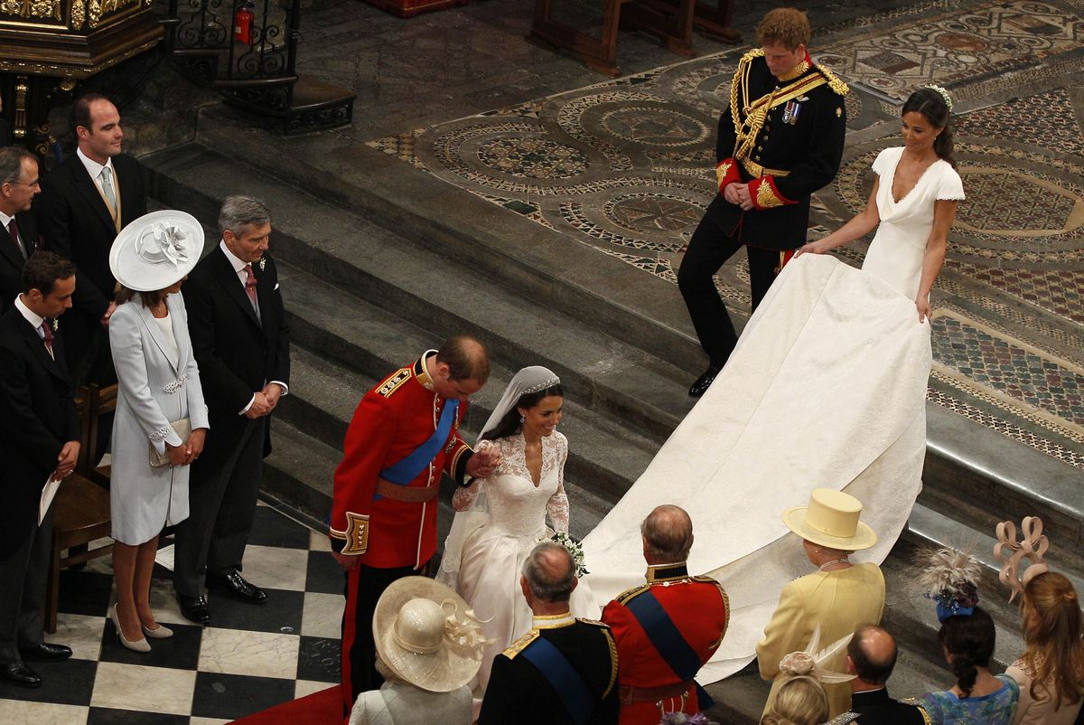 <p>After their wedding, Prince William bows and then-Duchess Kate curtsies to Queen Elizabeth as they head back down the aisle of Westminster Abbey.</p>