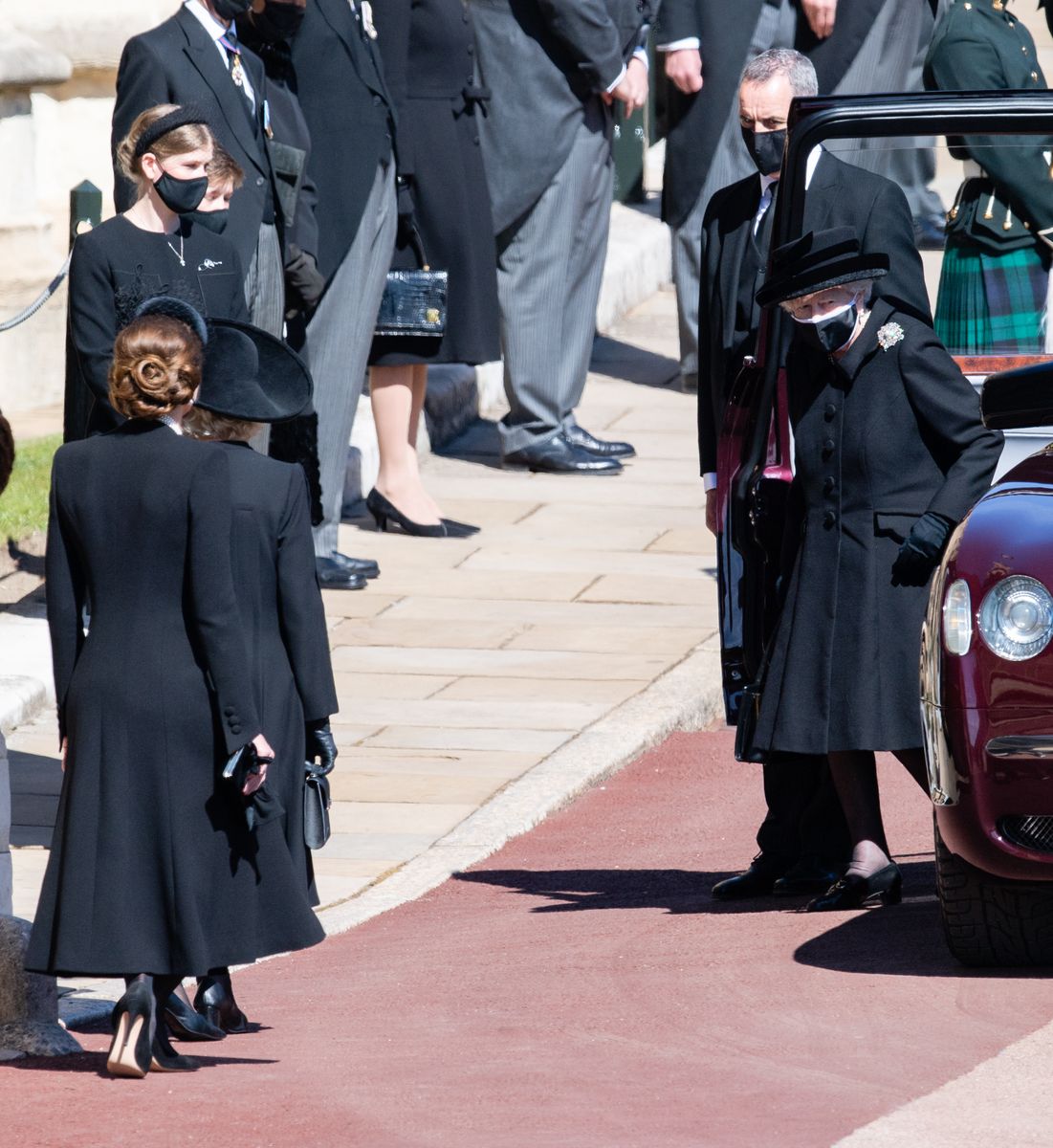 <p>Kate dips into a low bow as Queen Elizabeth exits her car to enter the <a href="https://www.harpersbazaar.com/celebrity/latest/g36146426/prince-philip-funeral-photos/">funeral</a> of her late husband, Prince Philip, Duke of Edinburgh.</p>